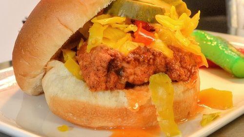 A hand-breaded free-range fried chicken sandwich is one of many specialty foods available at the new Mercedes-Benz Stadium. (Chris Hunt/Special)