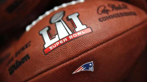 The New England Patriots' NFL Super Bowl LI game ball is finished with the team's logo affixed to it at the Wilson Sporting Goods factory Monday, Jan. 23, 2017, in Ada, Ohio.