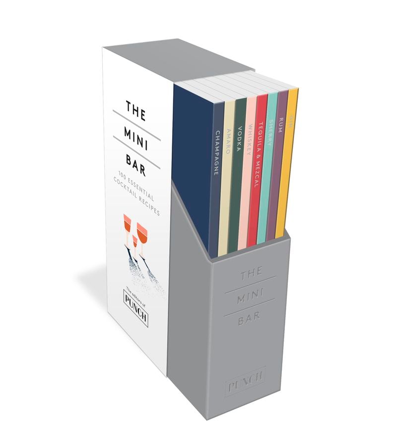 The tiny slipcase of the Mini Bar holds more than 100 cocktail recipes in eight books.