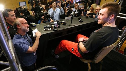 Georgia quarterback Jake Fromm is surrounded by media members with questions during his press conference for the Rose Bowl Thursday. It was Fromm’s first formal press conference since he signed his letter of intent.