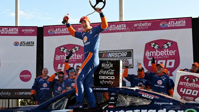 Joey Logano celebrates in Victory Lane after winning the Ambetter Health 400 NASCAR Cup Series Race at Atlanta Motor Speedway, March 19, 2023, in Hampton. (Hyosub Shin / Hyosub.Shin@ajc.com)