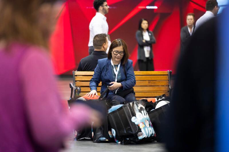 Jennifer Cua of Las Vegas sits with her purchases from Squishmallows during the Berkshire Hathaway annual meeting on Saturday, May 4, 2024, in Omaha, Neb. (AP Photo/Rebecca S. Gratz)