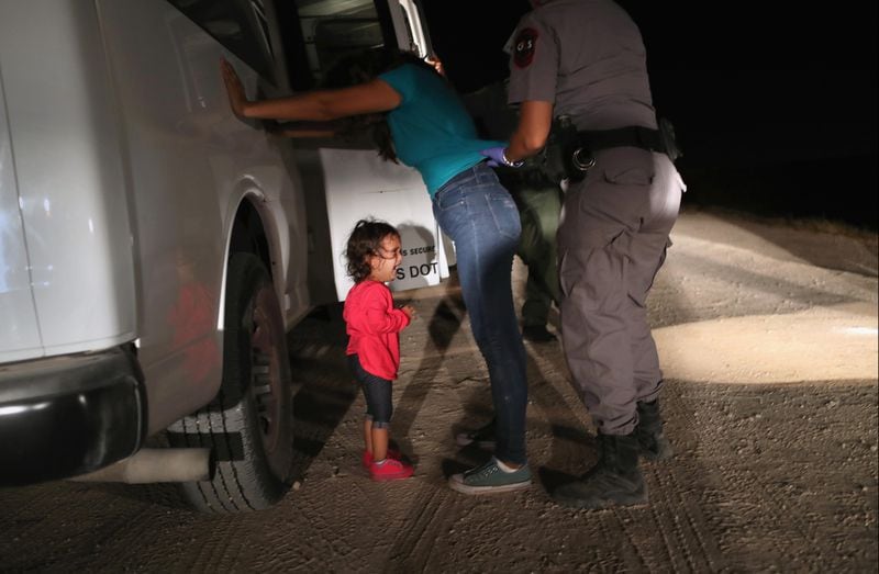 A two-year-old Honduran asylum seeker cries as her mother is searched and detained near the U.S.-Mexico border on June 12, 2018 in McAllen, Texas. The asylum seekers had rafted across the Rio Grande from Mexico and were detained by U.S. Border Patrol agents before being sent to a processing center for possible separation. Customs and Border Protection (CBP) is executing the Trump administration's zero tolerance policy towards undocumented immigrants. U.S. Attorney General Jeff Sessions also said that domestic and gang violence in immigrants' country of origin would no longer qualify them for political asylum status.  (Photo by John Moore/Getty Images)