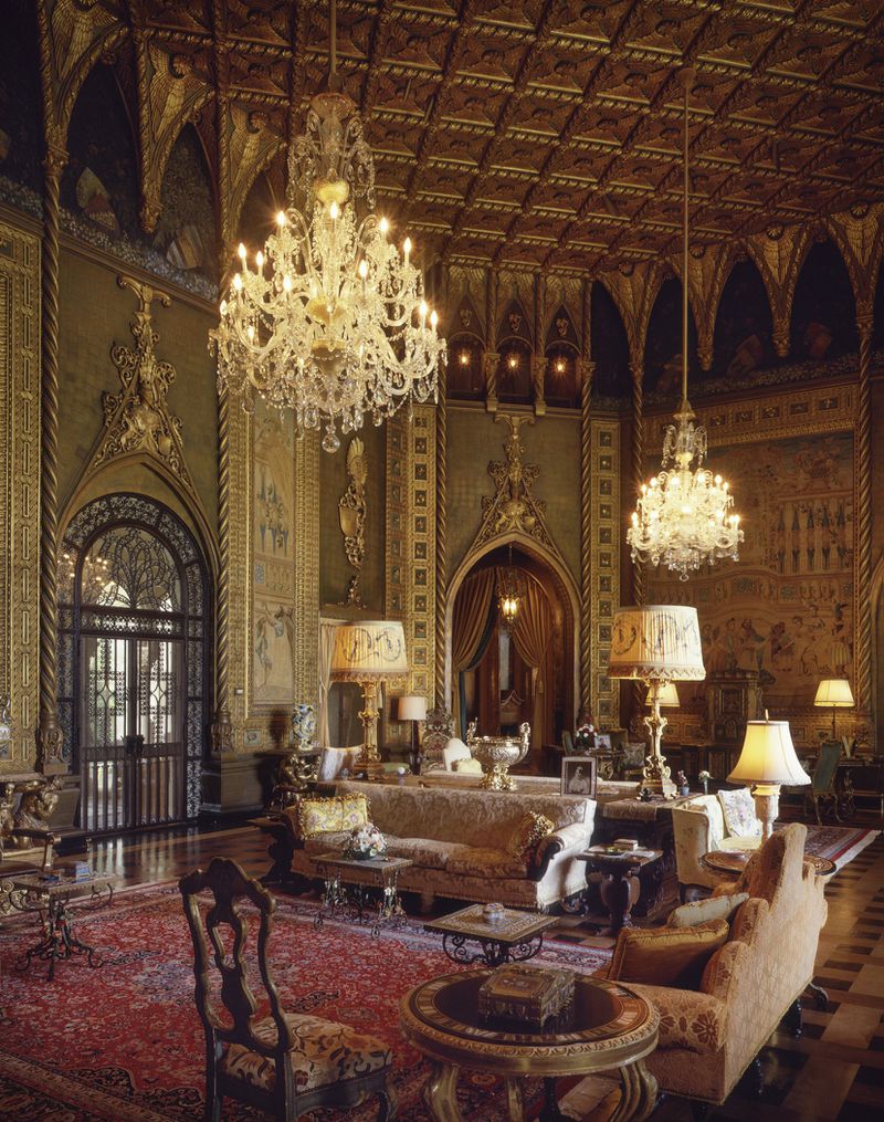 Mar-a-Lago’s gilded living room, as it appeared in 1993 after Donald and Ivana Trump restored the mansion to its original glory. Marjorie Merriweather Post’s original furniture, tapestries and art objects are organized the way Post displayed them while she was still alive. The 42-foot ceiling is a copy of the “Thousand-Wing ceiling” in Venice’s Accademia. Photo / C.J. Walker