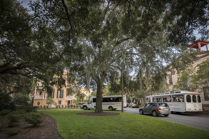 Two Savannah Tours trollies carry tourist around Susie King Taylor Square. (AJC Photo/Stephen B. Morton)