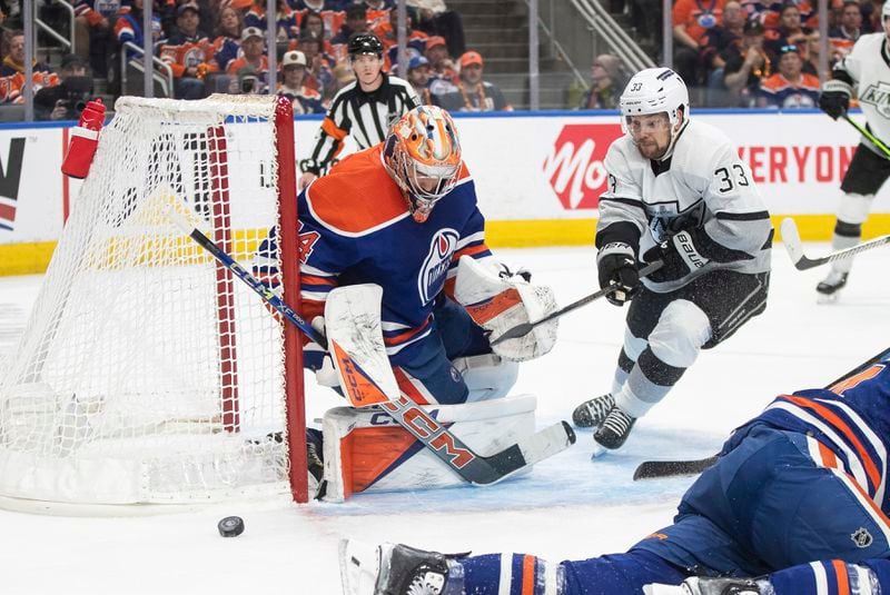 Los Angeles Kings' Viktor Arvidsson (33) is stopped by Edmonton Oilers goalie Stuart Skinner (74) during the third period of Game 2 of an NHL hockey Stanley Cup first-round playoff series Wednesday, April 24, 2024, in Edmonton, Alberta. (Jason Franson/The Canadian Press via AP)