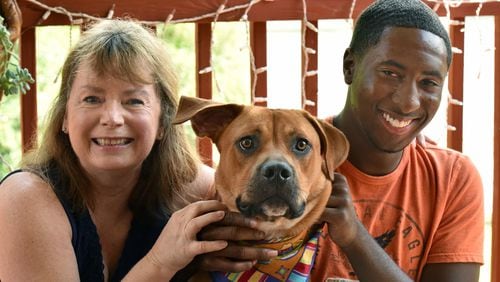 Vicki Van Der Hoek and Leon Shields with Vicki’s dog, Bobby, as Leon visited Vicki’s home in Morrow in August 2015. HYOSUB SHIN / HSHIN@AJC.COM