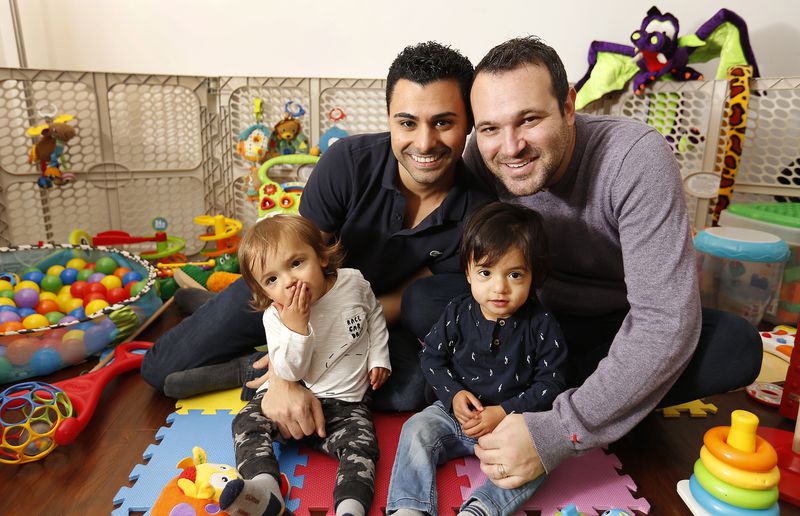 Elad Dvash-Banks, left, and his husband, Andrew, right, with their twin boys Ethan and Aiden at home in Los Angeles on January 26, 2018. The brothers were born minutes apart 16 months ago in Canada, but only Aiden received U.S. citizenship.