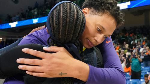 FILE - Phoenix Mercury center Brittney Griner, right, hugs former college teammate Dallas Wings guard Odyssey Sims after a WNBA basketball basketball game in Arlington, Texas, Friday, June 9, 2023. Griner says since her release from a Russian prison 17 months ago that she has used her platform as a WNBA All-Star and Olympic gold medalist to advocate for the return of other Americans detained overseas. (AP Photo/LM Otero, File)