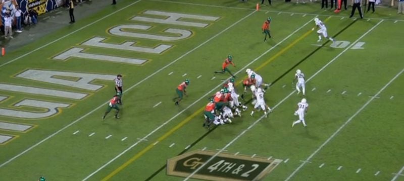 Miami’s defense converges on Laskey. Outside linebacker Raphael Kirby fills the “B” gap between right guard Shaquille Mason and Griffin in what Johnson termed an “easy stunt.” Said Johnson, “the outside linebacker came down and took him, which they were doing most of the night.” Safety Deon Bush (at the 5-yard line, just outside the right hashmark) had begun to fire forward, evidently assigned to either Thomas or Hill, but has his eyes on Laskey and is hesitating.