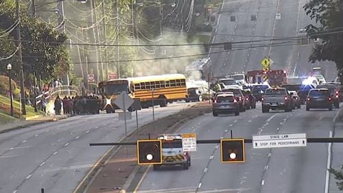 The crash happened shortly after 8 a.m. in the 3500 block of Buford Highway. There were about 40 middle school students on the bus at the time.