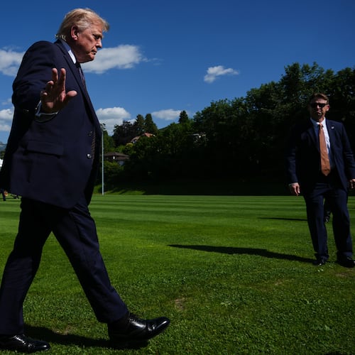 President Donald Trump waves to reporters as he arrives for the G7 summit, Monday, June 15, 2026, in Evian-les-Bains, France. (AP Photo/Julia Demaree Nikhinson)