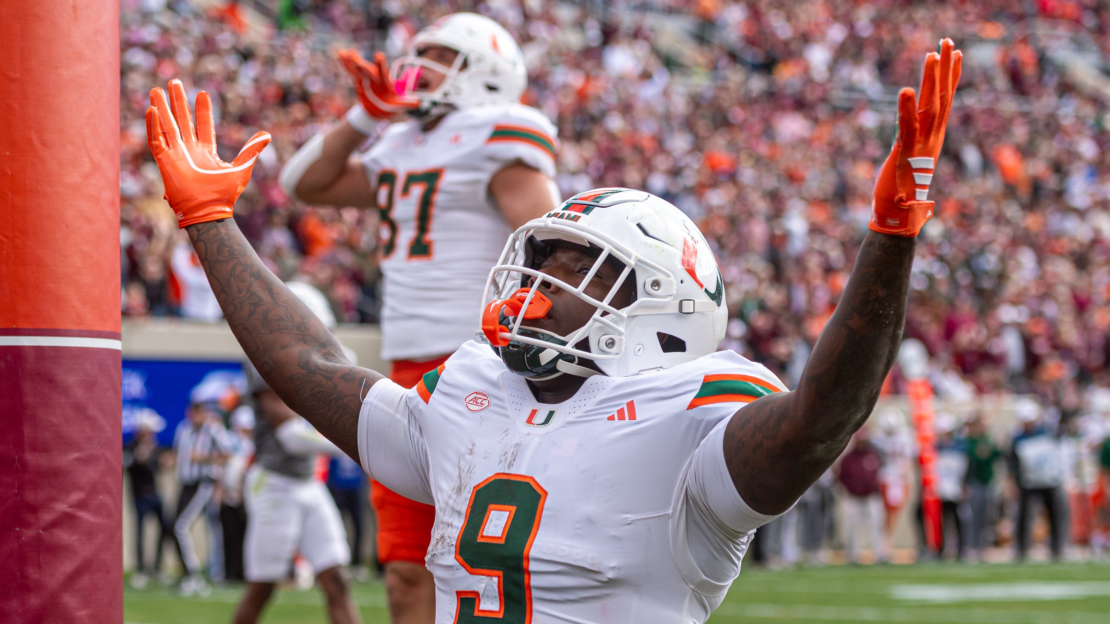 Miami tight end Elija Lofton (9) celebrates after a touchdown reception against Virginia Tech during the first half of an NCAA college football game, Saturday, Nov. 22, 2025, in Blacksburg, Va. (AP Photo/Robert Simmons)