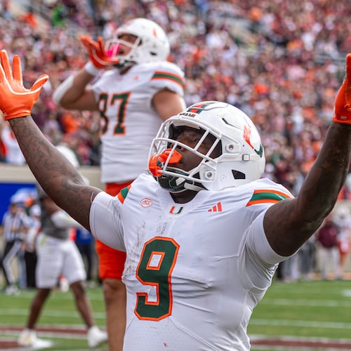Miami tight end Elija Lofton (9) celebrates after a touchdown reception against Virginia Tech during the first half of an NCAA college football game, Saturday, Nov. 22, 2025, in Blacksburg, Va. (AP Photo/Robert Simmons)