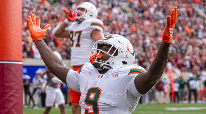Miami tight end Elija Lofton (9) celebrates after a touchdown reception against Virginia Tech during the first half of an NCAA college football game, Saturday, Nov. 22, 2025, in Blacksburg, Va. (AP Photo/Robert Simmons)
