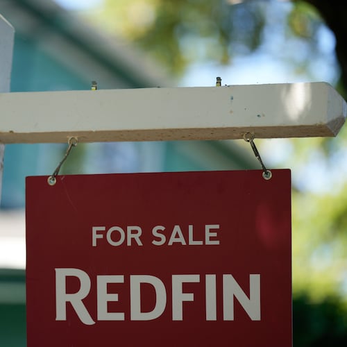 FILE - A "For Sale" sign is displayed outside a home on Friday, July 11, 2025, in Portland, Ore. (AP Photo/Jenny Kane, File)