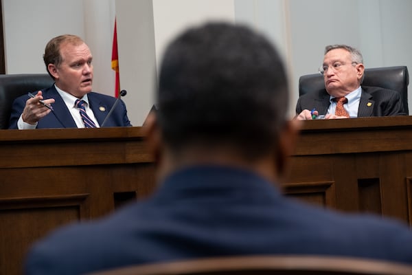 Judge Brian Rickman (left) and Judicial Qualifications Commission panelist Richard Hyde during a hearing in Atlanta on Dec. 19, 2024. (Ben Gray for the AJC 2024)