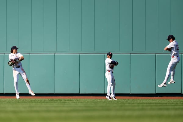Boston Red Sox's Jarren Duran, left, center fielder Ceddanne Rafaela and right fielder Roman Anthony celebrate defeating the Tampa Bay Rays in a baseball game, Sunday, July 13, 2025, in Boston. (AP Photo/Greg M. Cooper)