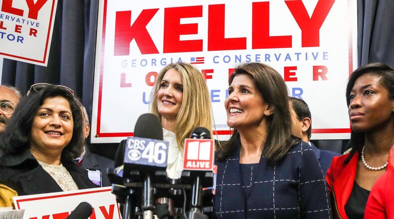 U.S. Sen. Kelly Loeffler, second from left, on Monday held her first rally since taking office. Appearing with her at the event in Marietta was former U.N. Ambassador Nikki Haley, third from left.