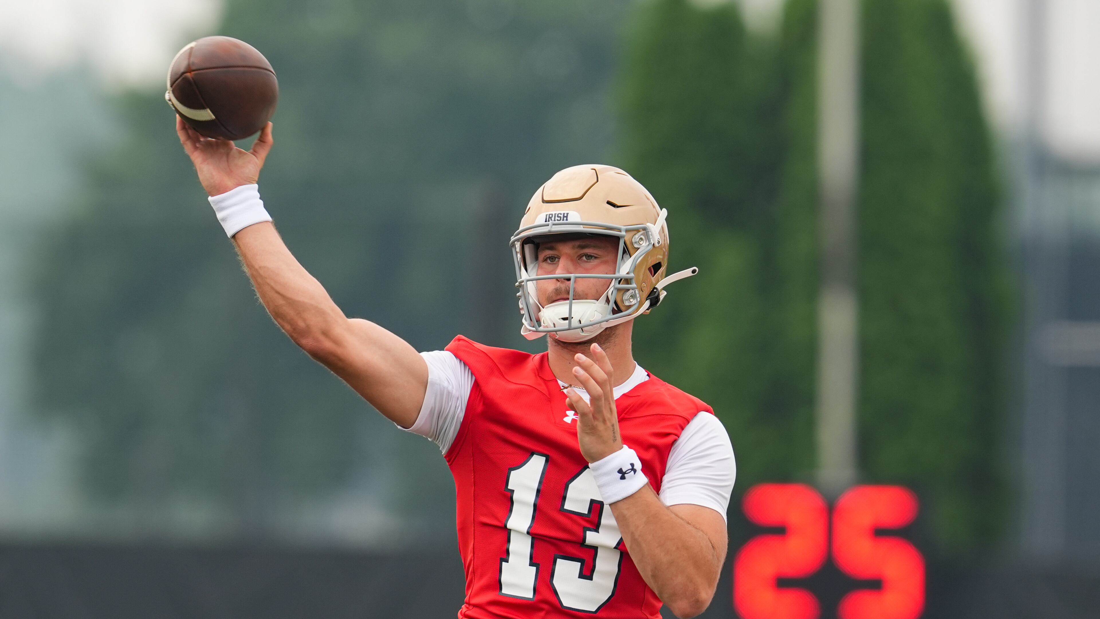 FILE - Notre Dame quarterback CJ Carr throws during NCAA college football practice in South Bend, Ind., July 31, 2025. (AP Photo/Michael Conroy, file)