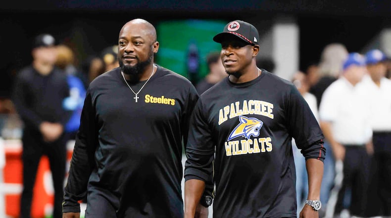 Falcons head coach Raheem Morris and the Pitsburg Steelers head coach Mike Tomlin interact moments before the game on Sunday, Sept. 8, at Mercedes-Benz Stadium in Atlanta. Falcons head coach wears an Apalachee High school shirt to support the recent events that shocked the community in Winder, Ga.
(Miguel Martinez/ AJC)