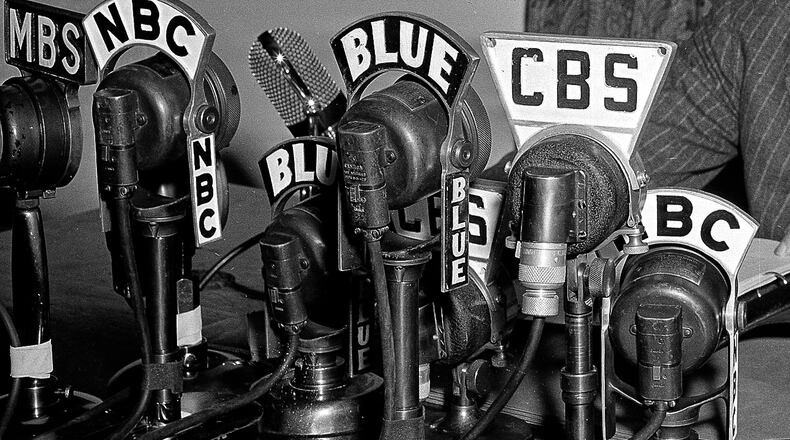 FILE - Network microphones on the desk as President Franklin D. Roosevelt addresses the nation from the White House in Washington on April 28, 1942. (AP Photo/File)
