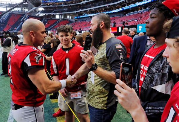 Matt Bryant (left) before a Falcons game in 2018.