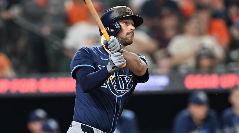 FILE - Tampa Bay Rays Brandon Lowe follows through on a solo home run against the Baltimore Orioles in the third inning of a baseball game, Wednesday, Sept. 24, 2025, in Baltimore. (AP Photo/Gail Burton, File)