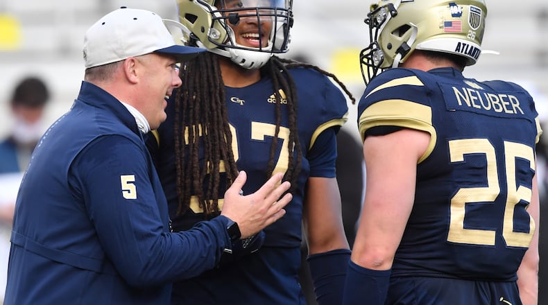 Georgia Tech coach Geoff Collins smiles as he instructs Georgia Tech linebacker Khaya Wright (37) and Georgia Tech linebacker Cole Neuber (26) during the 2021 Spring Game at Georgia Tech's Bobby Dodd Stadium in Atlanta on Friday, April 23, 2021. (Hyosub Shin / Hyosub.Shin@ajc.com)