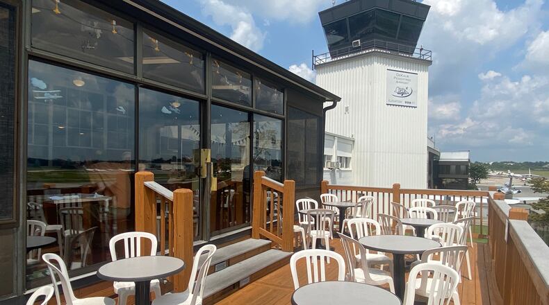 The patio at Downwind offers a close view of airplanes in action at DeKalb-Peachtree Airport. Ligaya Figueras/ligaya.figueras@ajc.com