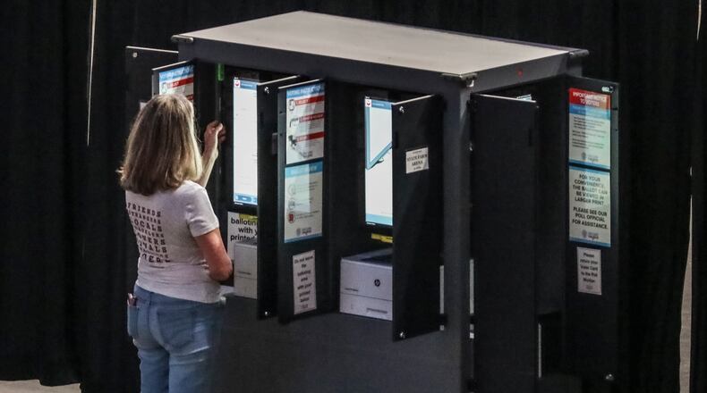 Early voting for Georgia’s runoff elections began Monday, July 20, 2020, including at a giant polling place on the Atlanta Hawks’ home court, State Farm Arena (shown here) in Atlanta. The runoffs will decide races left unsettled after last month’s primaries, including for the U.S. House of Representatives, Fulton County district attorney, the Georgia General Assembly and superior courts. JOHN SPINK / JSPINK@AJC.COM