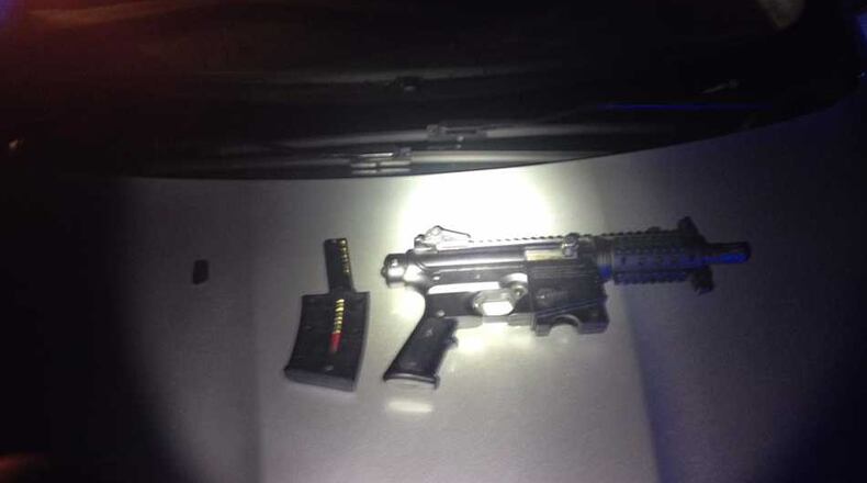 Three men were arrested after the incident on Monday. One is facing two felony charges and another was wanted by Atlanta police. Pictured is one of the two guns recovered.