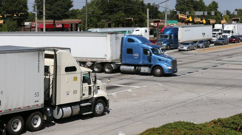Commercial trucks fill Fulton Industrial Boulevard at Camp Creek Parkway on Monday. Curtis Compton /ccompton@ajc.com