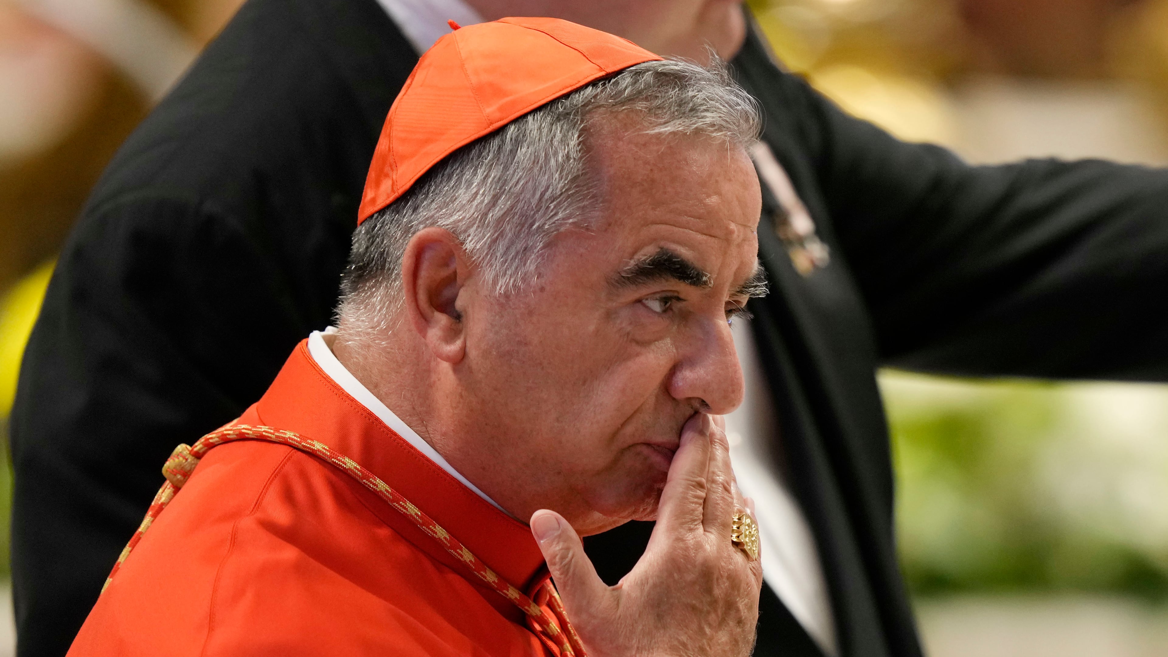 FILE - Cardinal Angelo Becciu attends the consistory inside St. Peter's Basilica at the Vatican, Aug. 27, 2022. (AP Photo/Andrew Medichini, File)