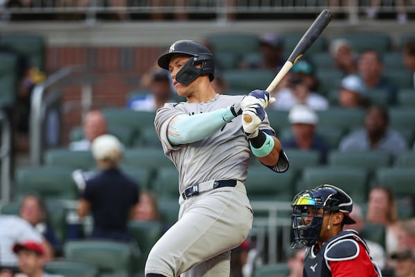 New York Yankees' Aaron Judge hits a single in the fourth inning of a baseball game against the Atlanta Braves, Friday, July 18, 2025, in Atlanta. (AP Photo/Colin Hubbard)