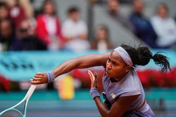 United States' Coco Gauff returns the ball against Mirra Andreeva of Russia at the Madrid Open quarter-final tennis match in Madrid, Spain, Wednesday, April 30, 2025. (AP Photo/Manu Fernandez)