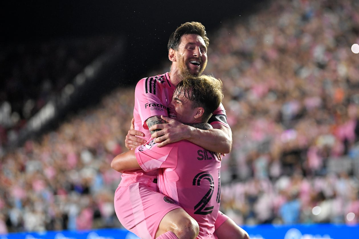 Inter Miami forward Lionel Messi, top, celebrates with forward Mateo Silvetti, bottom, after scoring during the first half of Game 3 in the first round of MLS soccer's Western Conference playoffs against Nashville SC in Fort Lauderdale, Fla., Nov. 8, 2025. (AP Photo/Michael Laughlin)