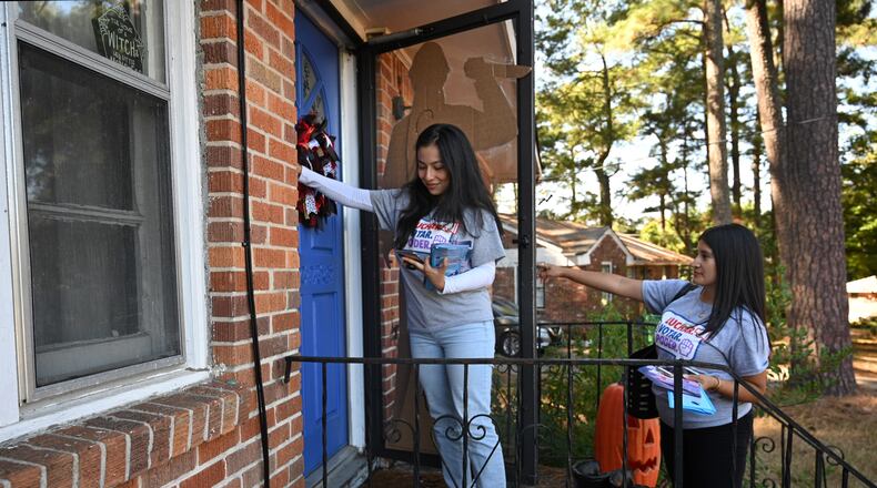 October 19, 2022 Forest Park - Bryna Jimenez (left) and Vanessa Jasso, both with GALEO, canvass for Latino voters in Forest Park on Tuesday, August 19, 2022. GALEO's mission is to increase civic engagement and leadership of the Latino/Hispanic community across Georgia. (Hyosub Shin / Hyosub.Shin@ajc.com)