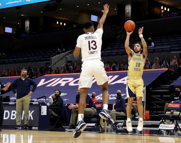 Georgia Tech guard Jose Alvarado (10) shoots over Virginia guard Casey Morsell (13) during an NCAA college basketball game Saturday, Jan. 23, 2021, in Charlottesville, Va. (Andrew Shurtleff/The Daily Progress via AP, Pool)