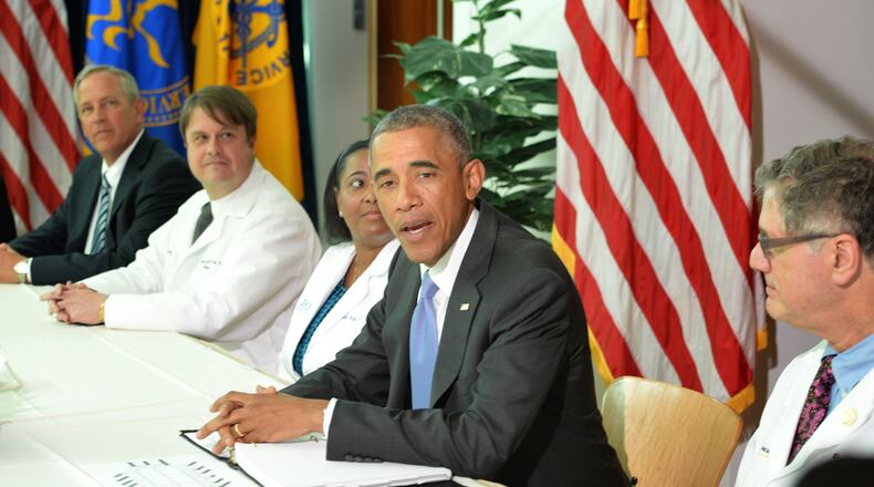 September 16, 2014 Atlanta - President Barack Obama speaks as he meets with Emory University doctors and healthcare professionals at the Centers for Disease Control and Prevention in Atlanta on Tuesday, September, 16, 2014. President Barack Obama visits the Centers for Disease Control and Prevention to receive a briefing on the outbreak of the Ebola virus in West Africa, discuss the U.S. response, and thank the scientists, doctors, and health care workers who are helping those affected by disease at home and around the world. HYOSUB SHIN / HSHIN@AJC.COM