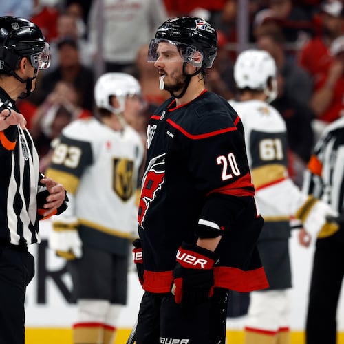 Carolina Hurricanes' Sebastian Aho (20) gets an explanation from an official during the second period in Game 1 of the NHL hockey Stanley Cup Final series against the Vegas Golden Knights in Raleigh, N.C., Tuesday, June 2, 2026. (AP Photo/Karl DeBlaker)