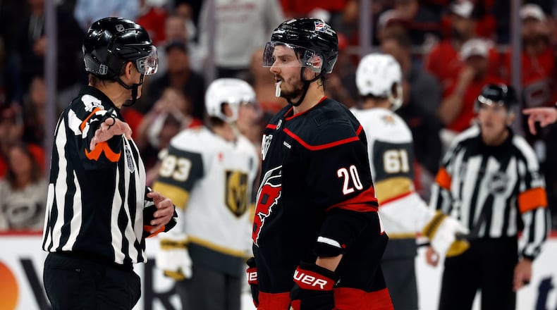 Carolina Hurricanes' Sebastian Aho (20) gets an explanation from an official during the second period in Game 1 of the NHL hockey Stanley Cup Final series against the Vegas Golden Knights in Raleigh, N.C., Tuesday, June 2, 2026. (AP Photo/Karl DeBlaker)