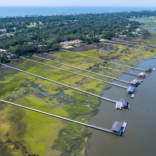 Docks extend across the marsh on Sea Island, Ga., Friday, June 17, 2026. (Justin Taylor/The Current/CatchLight/Report for America via AP)