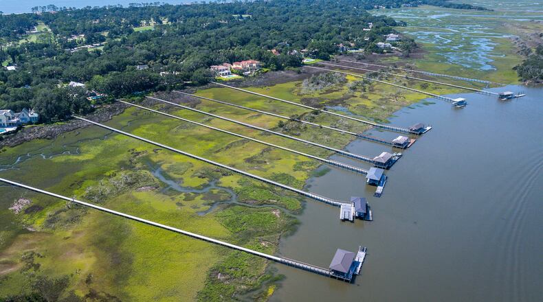 Docks extend across the marsh on Sea Island, Ga., Friday, June 17, 2026. (Justin Taylor/The Current/CatchLight/Report for America via AP)