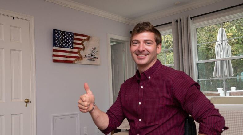 Retired Army Capt. Dan Berschinski, who was wounded while serving in Afghanistan in 2009, gives a thumbs-up to recent home renovations. (Courtesy of Duane Stork)