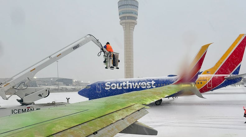 Airlines deice aircraft at Hartsfield-Jackson International Airport on Friday, January 10, 2025.
