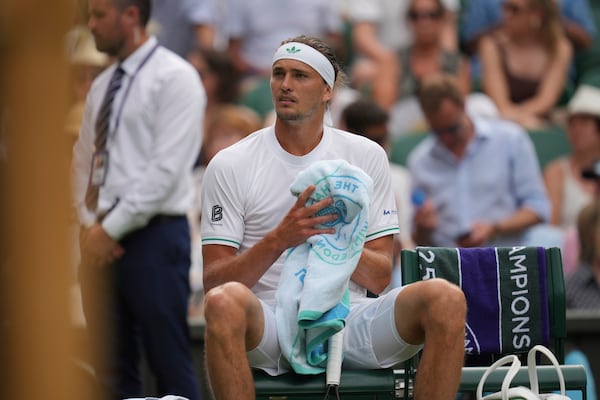 Alexander Zverev of Germany reacts as he plays Arthur Rinderknech of France during their first round men's singles match at the Wimbledon Tennis Championships in London, Tuesday, July 1, 2025. (AP Photo/Kin Cheung)