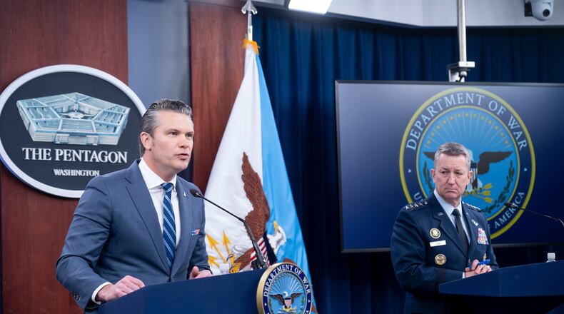 Defense Secretary Pete Hegseth and Chairman of the Joint Chiefs of Staff Gen. Dan Caine speaks to members of the media during a press briefing at the Pentagon, Thursday, April 16, 2026 in Washington. (AP Photo/Kevin Wolf)