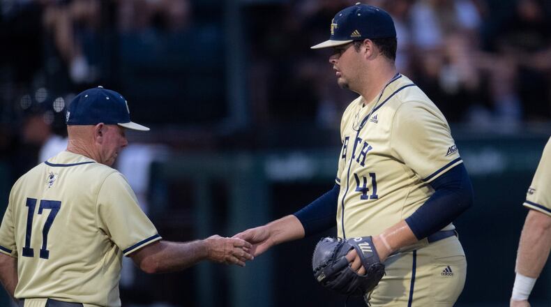 Georgia Tech pitcher Zach Maxwell (41) hands the ball over to coach Danny Hall during an NCAA college baseball tournament regional game against Vanderbilt on Saturday, June 5, 2021, in Nashville, Tenn. (George Walker IV/The Tennessean via AP)