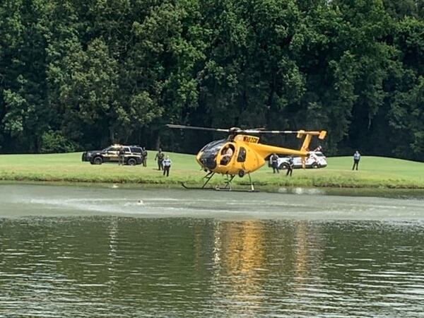 Officers used several methods to scare the alligators away from the suspect, including requesting Eagle One to hover over the pond near the alligators.
